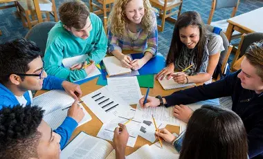 A group of teen students studying