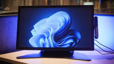 A computer monitor on a desk