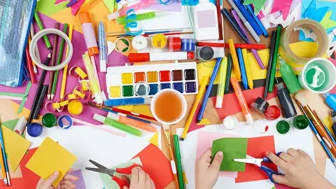 Colorful art supplies on a table.