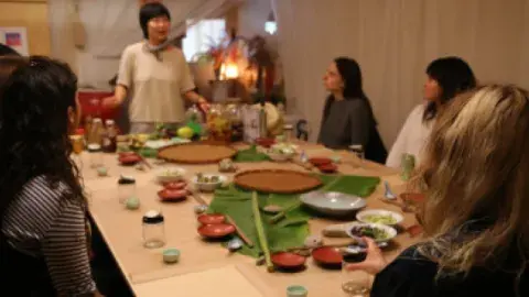 Group cooking class around table