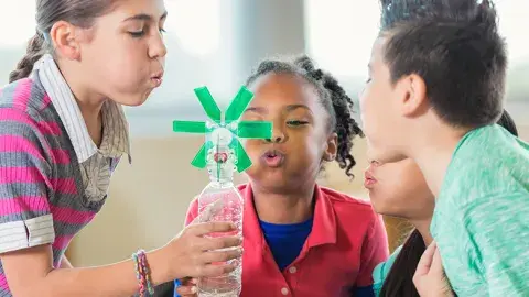 Kids doing a science experiment.