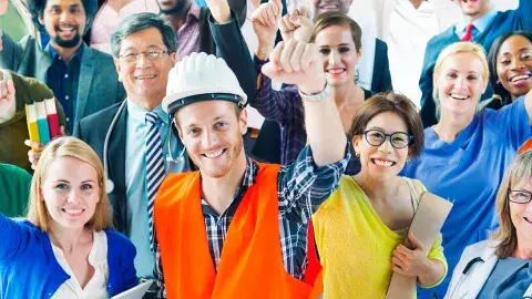 workers raise fists in victory